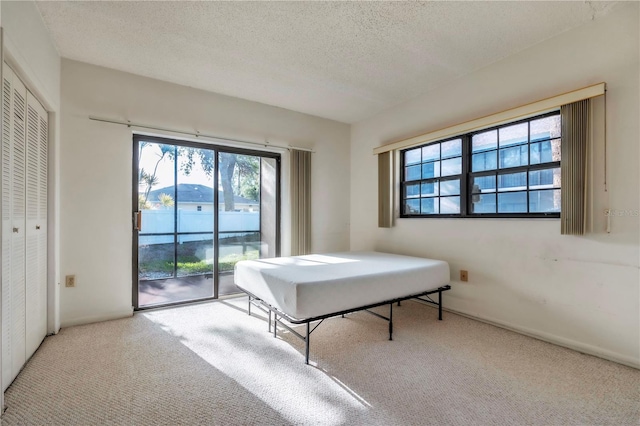 2727 75th St W Unit 1Af, Bradenton, FL 34209 - game room featuring carpet flooring and a textured ceiling