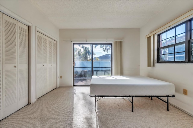 2727 75th St W Unit 1Af, Bradenton, FL 34209 - game room with healthy amount of natural light, a textured ceiling, and carpet flooring