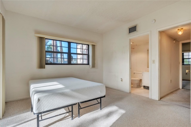 2727 75th St W Unit 1Af, Bradenton, FL 34209 - bedroom with carpet and ensuite bath