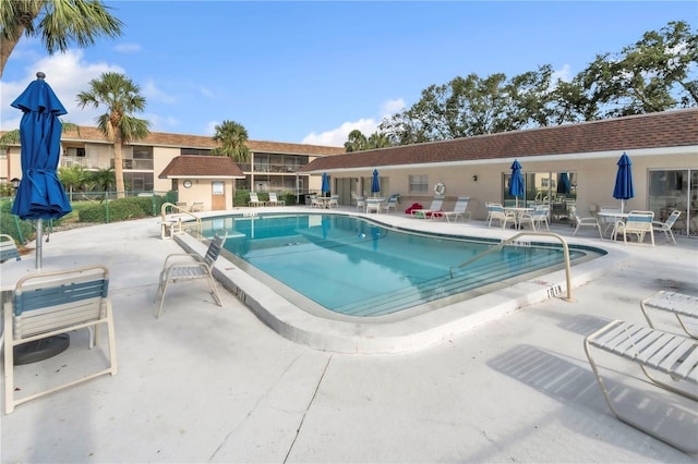 2727 75th St W Unit 1Af, Bradenton, FL 34209 - community pool with a patio area and an outdoor structure