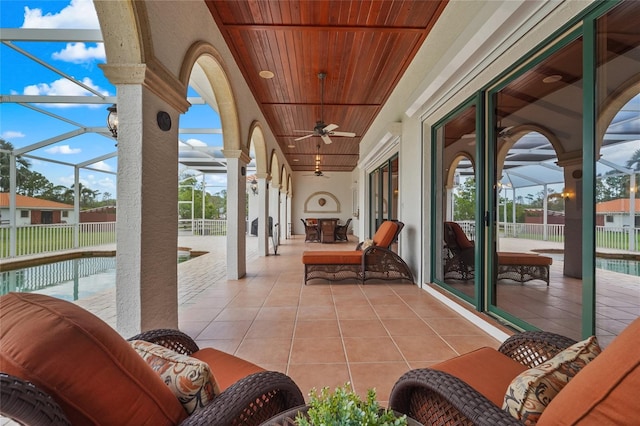 7025 Saddle Creek Cir, Sarasota, FL 34241 - view of patio with ceiling fan and a lanai