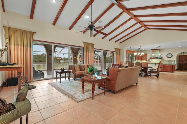 7025 Saddle Creek Cir, Sarasota, FL 34241 - living room featuring light tile patterned flooring, high vaulted ceiling, ceiling fan, a chandelier, and beamed ceiling