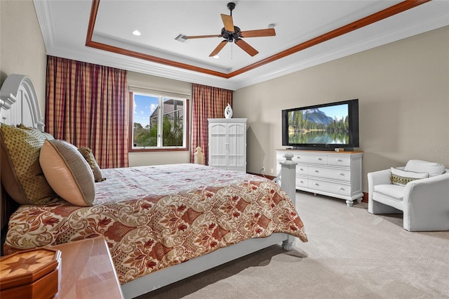7025 Saddle Creek Cir, Sarasota, FL 34241 - carpeted bedroom with a tray ceiling, ornamental molding, a ceiling fan, and recessed lighting