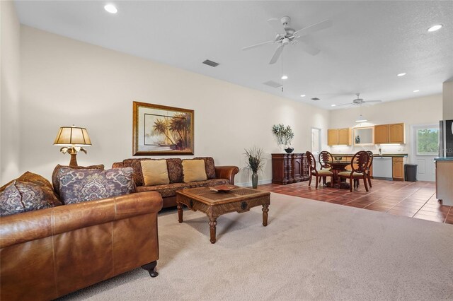 7025 Saddle Creek Cir, Sarasota, FL 34241 - carpeted living room with ceiling fan, recessed lighting, and tile patterned floors