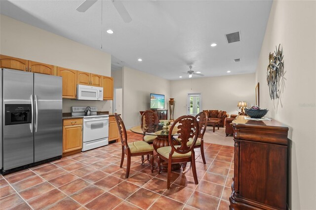 7025 Saddle Creek Cir, Sarasota, FL 34241 - tiled dining area with ceiling fan and recessed lighting