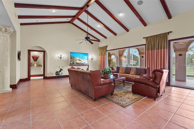 7025 Saddle Creek Cir, Sarasota, FL 34241 - living area featuring light tile patterned floors, ceiling fan, beam ceiling, healthy amount of natural light, and high vaulted ceiling