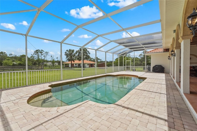 7025 Saddle Creek Cir, Sarasota, FL 34241 - view of swimming pool with a patio, a fenced backyard, and glass enclosure