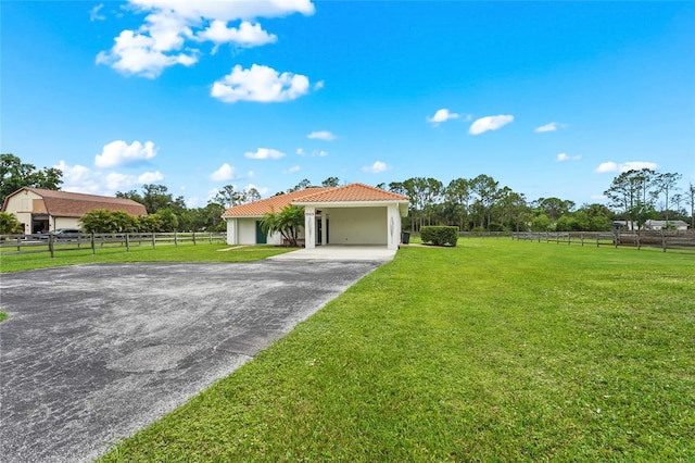 7025 Saddle Creek Cir, Sarasota, FL 34241 - view of front of property with a tiled roof, asphalt driveway, and stucco siding