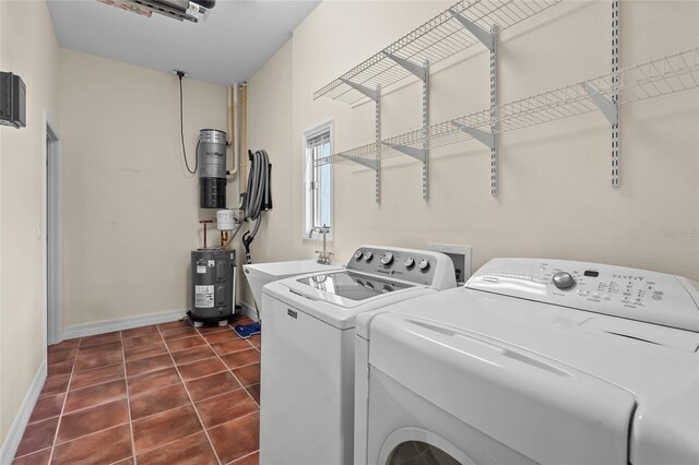 7025 Saddle Creek Cir, Sarasota, FL 34241 - washroom with separate washer and dryer, electric water heater, and dark tile patterned flooring