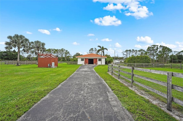 7025 Saddle Creek Cir, Sarasota, FL 34241 - view of front of home featuring an outbuilding, driveway, and a pole building