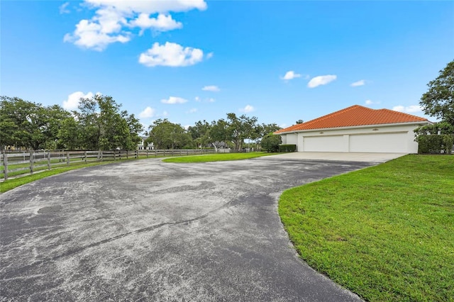 7025 Saddle Creek Cir, Sarasota, FL 34241 - view of front of property with driveway, a garage, and a tiled roof