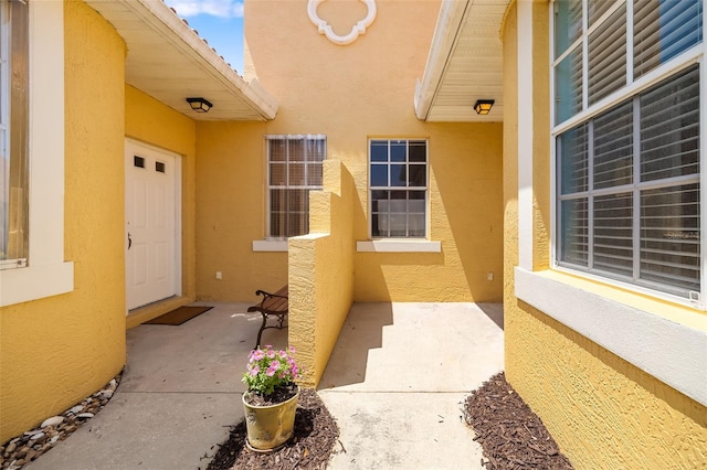 5609 Spanish Point Ct, Palmetto, FL 34221 - doorway to property with stucco siding