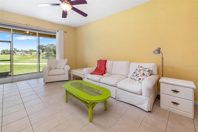 5609 Spanish Point Ct, Palmetto, FL 34221 - living room with a ceiling fan, light tile patterned floors, and view of golf course