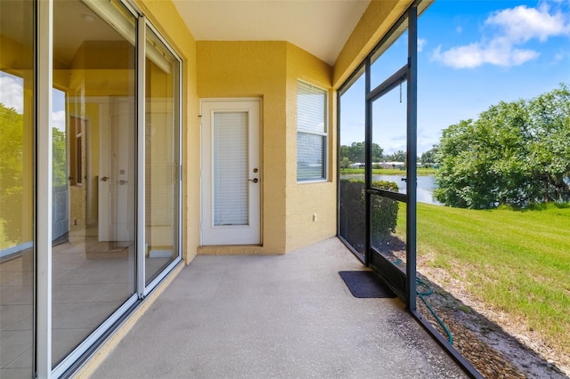5609 Spanish Point Ct, Palmetto, FL 34221 - unfurnished sunroom featuring a water view