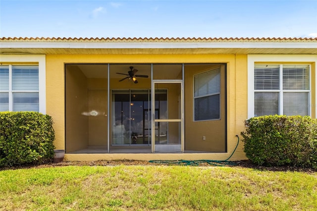 5609 Spanish Point Ct, Palmetto, FL 34221 - property entrance featuring stucco siding and a yard