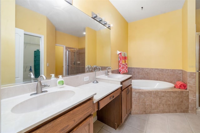 5609 Spanish Point Ct, Palmetto, FL 34221 - bathroom with tile patterned flooring, double vanity, a stall shower, and a bath