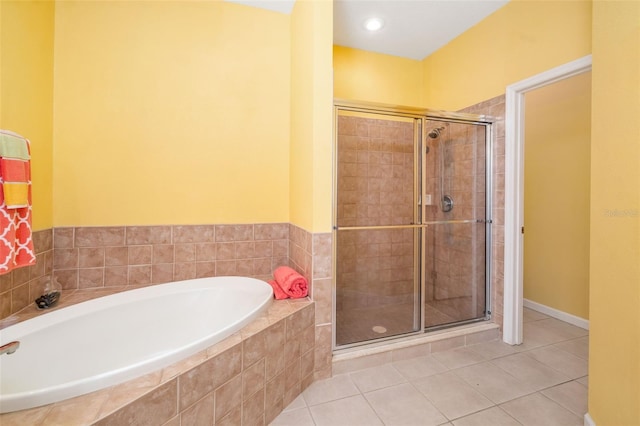 5609 Spanish Point Ct, Palmetto, FL 34221 - full bath with a bath, a shower stall, and tile patterned flooring