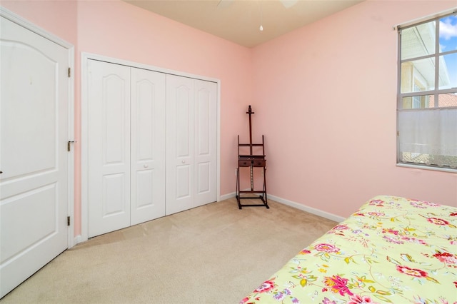 5609 Spanish Point Ct, Palmetto, FL 34221 - bedroom with carpet flooring, a closet, and baseboards