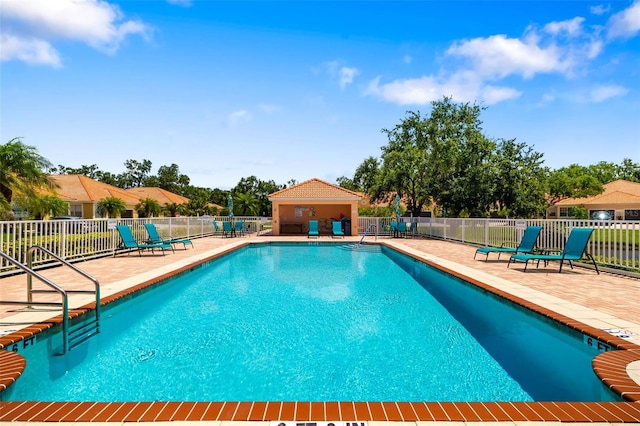 5609 Spanish Point Ct, Palmetto, FL 34221 - community pool featuring a patio area