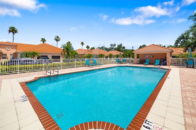 5609 Spanish Point Ct, Palmetto, FL 34221 - community pool featuring a patio