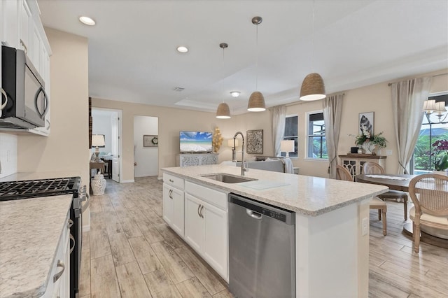 4524 Baltry Ct, Bradenton, FL 34211 - kitchen with stainless steel appliances, a sink, light wood-style flooring, healthy amount of natural light, and recessed lighting