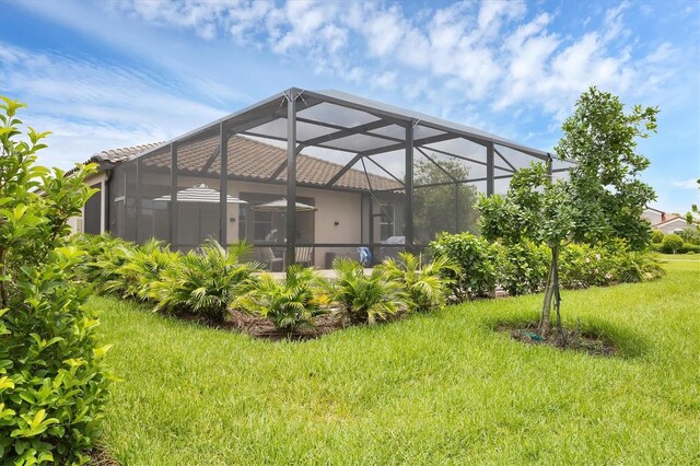 4524 Baltry Ct, Bradenton, FL 34211 - back of property featuring a lawn, a lanai, and stucco siding