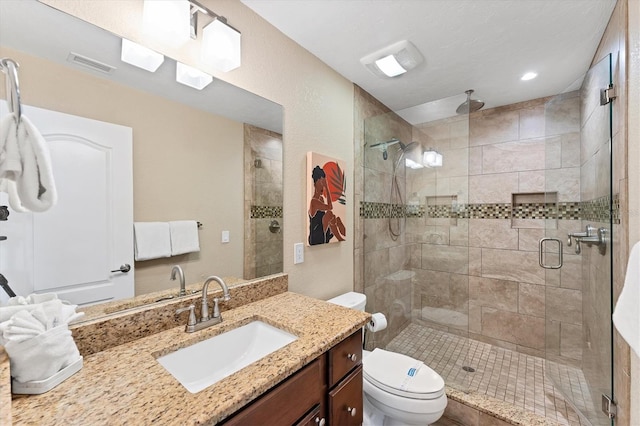 7727 9th Avenue Dr NW, Bradenton, FL 34209 - bathroom with vanity, a stall shower, toilet, and recessed lighting
