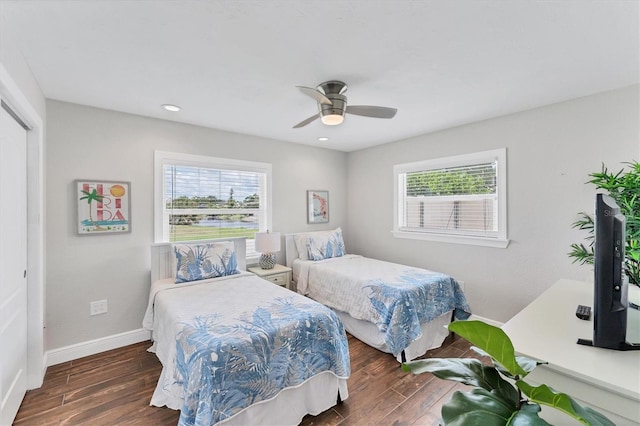 7727 9th Avenue Dr NW, Bradenton, FL 34209 - bedroom featuring multiple windows, wood finished floors, and baseboards