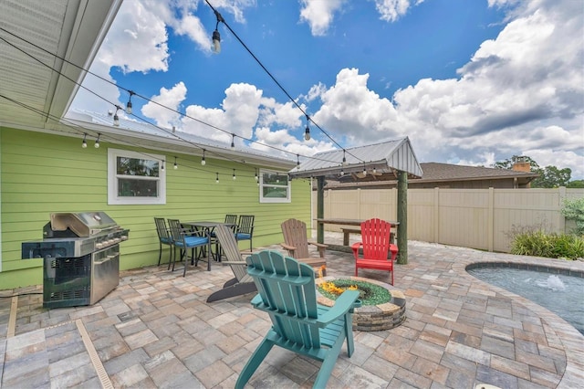 7727 9th Avenue Dr NW, Bradenton, FL 34209 - view of patio / terrace featuring an outdoor fire pit, a grill, and a gazebo