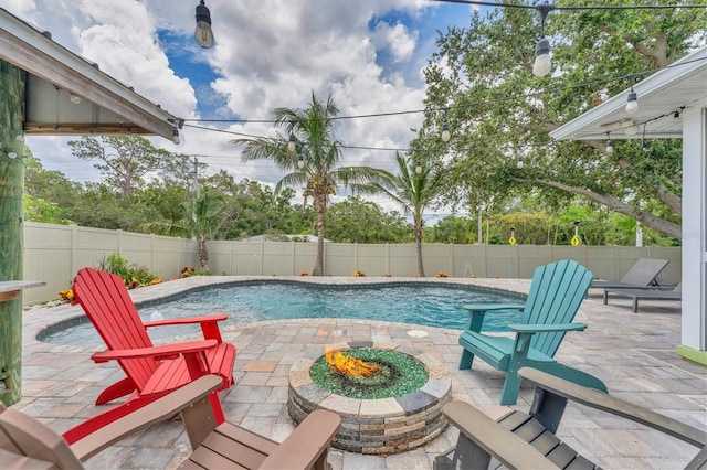 7727 9th Avenue Dr NW, Bradenton, FL 34209 - view of pool with a patio, a fenced backyard, and an outdoor fire pit