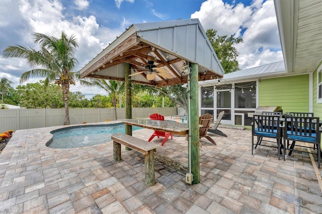 7727 9th Avenue Dr NW, Bradenton, FL 34209 - view of pool with outdoor dining space, a sunroom, a patio, and a fenced backyard