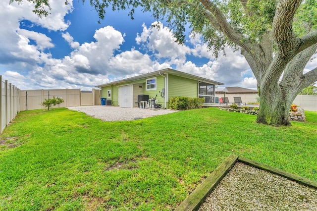 7727 9th Avenue Dr NW, Bradenton, FL 34209 - back of property featuring a sunroom and a patio