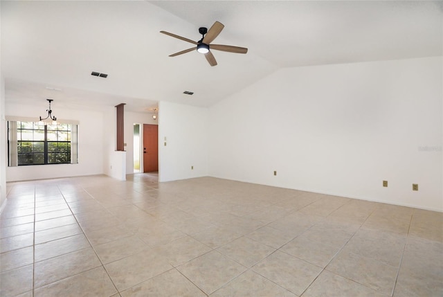 7401 3rd Ave NW, Bradenton, FL 34209 - empty room with vaulted ceiling, light tile patterned floors, ceiling fan, and a chandelier