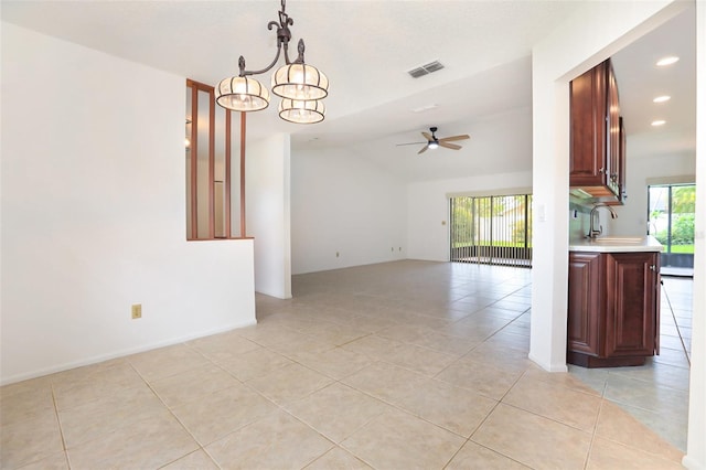 7401 3rd Ave NW, Bradenton, FL 34209 - empty room with ceiling fan, light tile patterned floors, a chandelier, recessed lighting, and vaulted ceiling
