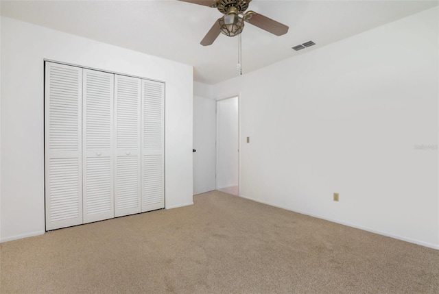 7401 3rd Ave NW, Bradenton, FL 34209 - unfurnished bedroom featuring carpet flooring, a closet, and a ceiling fan
