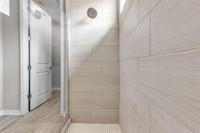 4869 Antrim Dr, Sarasota, FL 34240 - bathroom with a shower stall and baseboards
