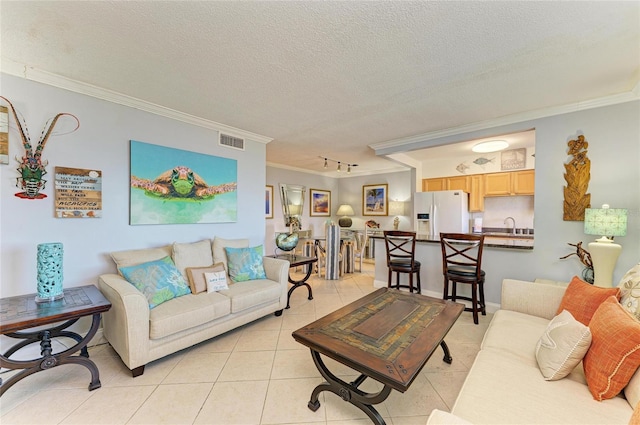 767 John Ringling Blvd Unit 25, Sarasota, FL 34236 - living room with crown molding, light tile patterned floors, and a textured ceiling
