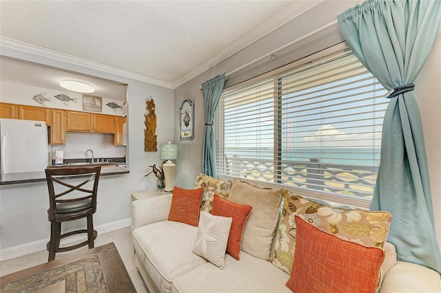 767 John Ringling Blvd Unit 25, Sarasota, FL 34236 - living area featuring crown molding, baseboards, and a textured ceiling