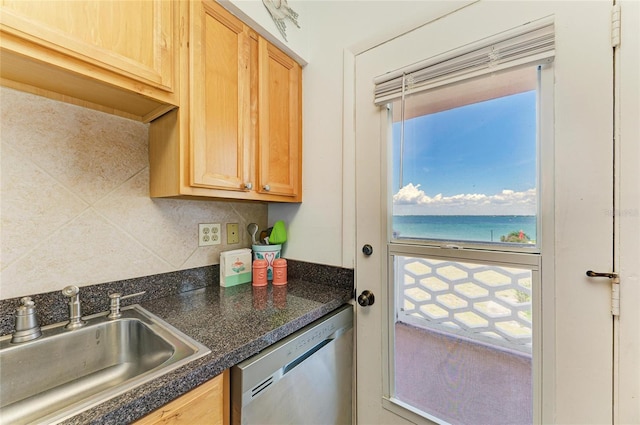 767 John Ringling Blvd Unit 25, Sarasota, FL 34236 - kitchen with a sink, stainless steel dishwasher, dark countertops, decorative backsplash, and light brown cabinetry