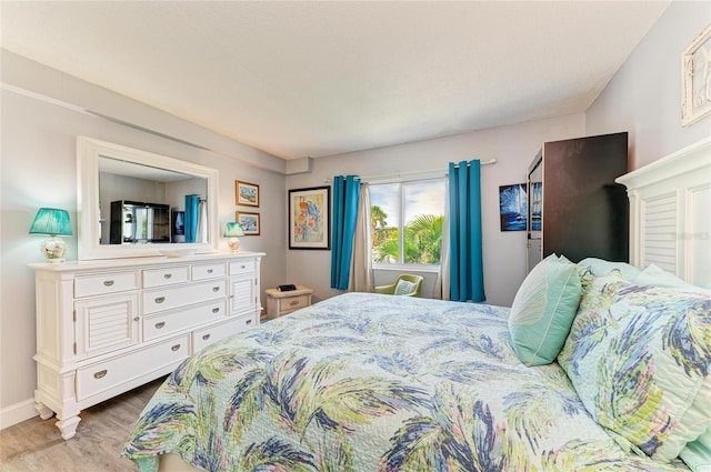 767 John Ringling Blvd Unit 25, Sarasota, FL 34236 - bedroom with wood finished floors and baseboards