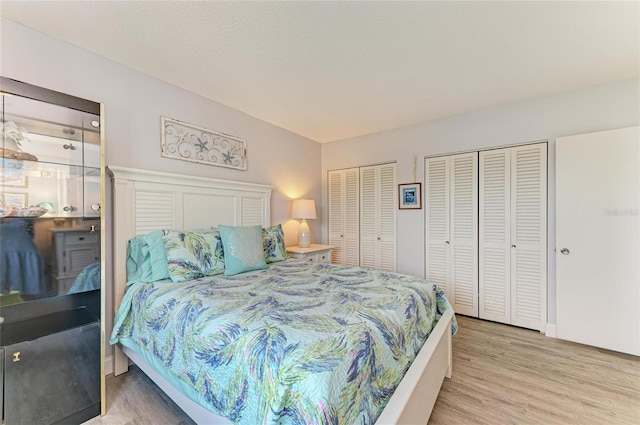767 John Ringling Blvd Unit 25, Sarasota, FL 34236 - bedroom with multiple closets and light wood-style floors