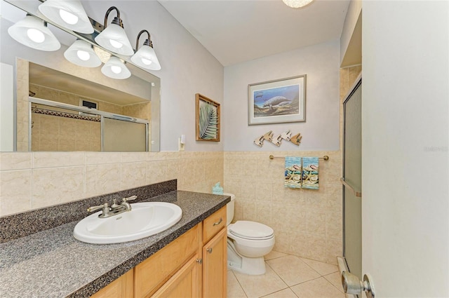 767 John Ringling Blvd Unit 25, Sarasota, FL 34236 - full bath featuring tile walls, tile patterned floors, a shower stall, toilet, and vanity