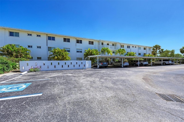 767 John Ringling Blvd Unit 25, Sarasota, FL 34236 - view of building exterior featuring covered and uncovered parking