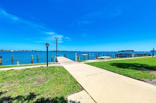 767 John Ringling Blvd Unit 25, Sarasota, FL 34236 - dock area featuring a yard and a water view
