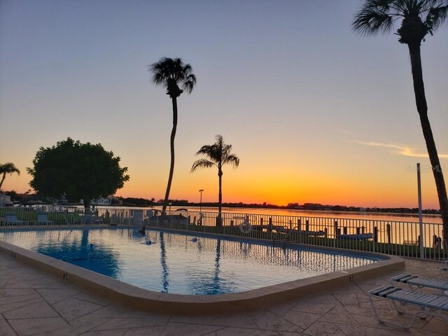767 John Ringling Blvd Unit 25, Sarasota, FL 34236 - pool at dusk featuring a community pool and a patio