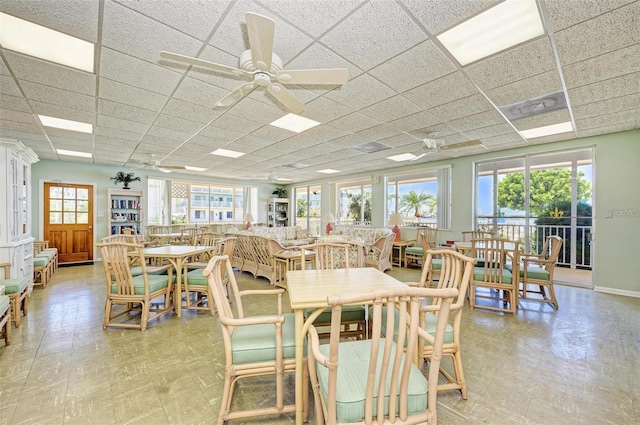767 John Ringling Blvd Unit 25, Sarasota, FL 34236 - dining area featuring plenty of natural light, a paneled ceiling, light floors, and a ceiling fan