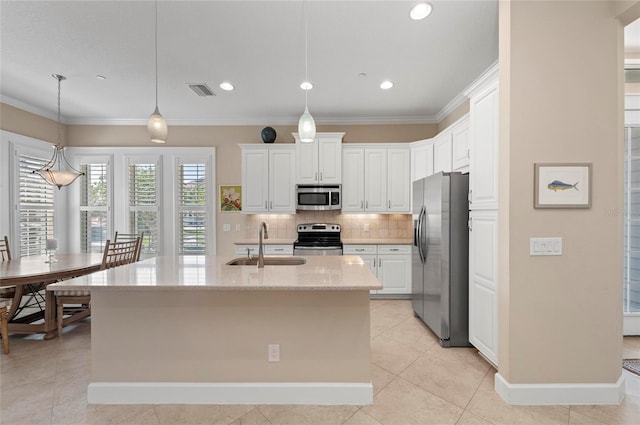 315 Sapphire Lake Dr Unit 101, Bradenton, FL 34209 - kitchen with appliances with stainless steel finishes, tasteful backsplash, white cabinets, light tile patterned floors, and light stone countertops