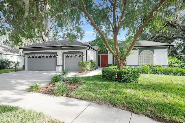 5103 Twin Creeks Dr, Valrico, FL 33596 - ranch-style house with stucco siding, an attached garage, concrete driveway, and a shingled roof