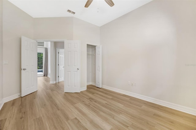 5103 Twin Creeks Dr, Valrico, FL 33596 - unfurnished bedroom with light wood-type flooring, a closet, ceiling fan, and lofted ceiling