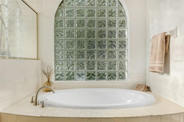 5103 Twin Creeks Dr, Valrico, FL 33596 - full bathroom with a bath and healthy amount of natural light